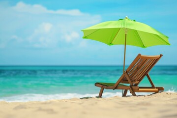 Fototapeta premium A bright and inviting beach scene featuring a green umbrella and a wooden recliner, set against the backdrop of turquoise waters and a clear blue sky on a sunny day.