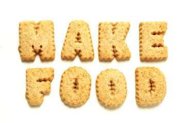 Word make food with letters made from cookie on white background.