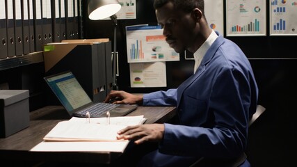 Black man with expertise in criminal investigation, analyzes files, photos, and statements to...