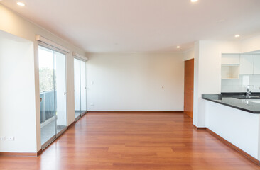 apartment living room with bay window and hardwood floor