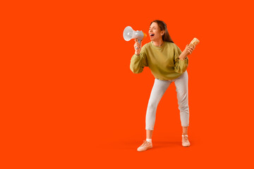 Young woman with doner kebab shouting into megaphone on orange background