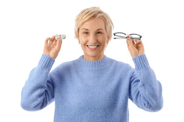 Obraz premium Mature woman with contact lens case and eyeglasses on white background