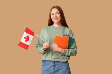 Female student with notebooks and flag of Canada on brown background