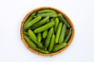 Mini cucumbers on white background.