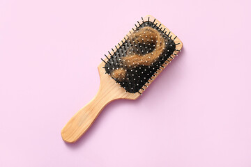 Brush and question mark made of hair strand on lilac background. Hair loss problem