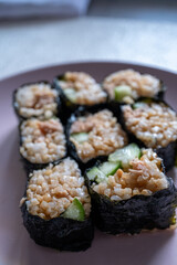 sushi rolls on a pink plate