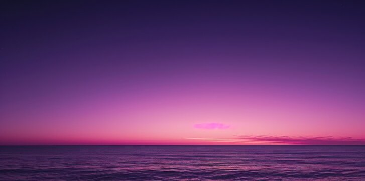Peaceful Purple Sunset Over the Ocean with Calm Waves.
