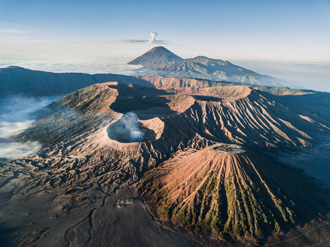 Aerial view, volcanic landscape with several volcanic craters and ash cloud, Mount Bromo, Java, Indonesia, Asia