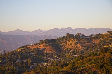 The towering San Gabriel Mountains loom over Los Angeles's San Fernando Valley as the day comes to the end