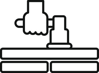 Construction worker is operating a jackhammer, breaking up a concrete surface