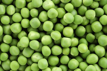 Fresh green peas as background, top view