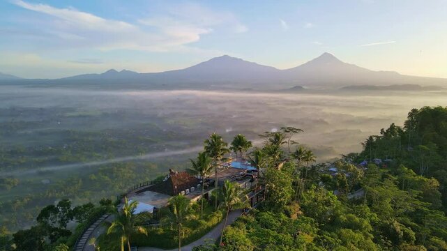 Aerial view of Enam Langit Plataran Restaurant in clear sunny morning. Drone shot.