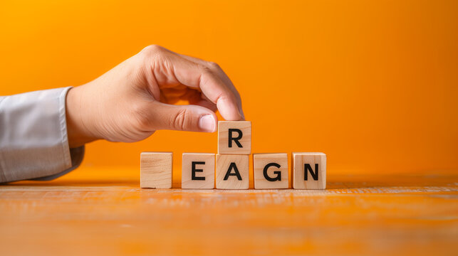 Recession fears symbol. Concept words Recession fears on wooden blocks on a beautiful orange table orange background. Businessman hand. Business and recession fears concept. Copy space 