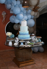 party room, birthday cake,table decoration, reception table, cake and sweet table, theme party, birthday party, cake with sea shells, maritime theme, 15th birthday party, 
a lot of balloons 