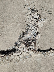 concrete wall with cracks and scratches