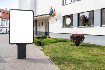 Blank Mockup Of Vertical Street Billboard On The Sidewalk. Advertising Poster Lightbox Next To High School