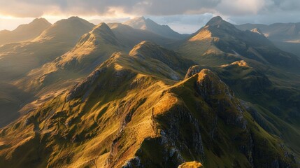 Fototapeta premium Soft sunrise light on a mountain range, casting gentle shadows across the valleys