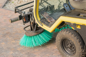Close-Up of Industrial Street Sweeper Brush Cleaning Paved Surface