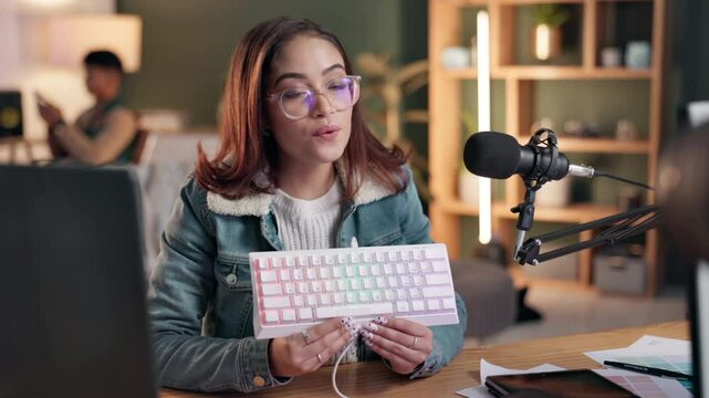 Keyboard, live stream and radio with woman content creator in office for audio blogging, broadcast or podcast. Media microphone and product review with influencer talking to audience of followers