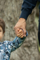 Family members holding hands together motherhood parents protection