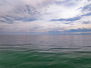 Fototapeta premium Aerial view of amazing sea surface water texture background,Beautiful sky clouds background