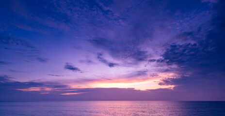 Fototapeta premium Nature beautiful Light Sunset or sunrise over sea, Colorful dramatic majestic scenery Sky with Amazing clouds and waves in sunset sky