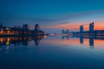 Fototapeta premium Cityscape at Twilight with Reflections on the Water