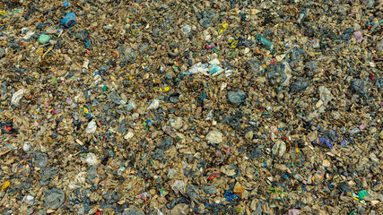 Top view trash, plastic cups and plastic bags at the beach. environmental problem concept and healing the world	

