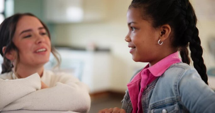 Student, teacher and girl in school, talking and asking of assignment for homework and woman. Classroom, happy and education for child, desk and chat for knowledge, learning and helping with project