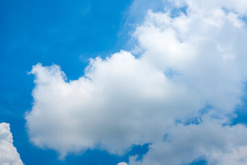 Tropical summer blue sky fluffy white cloud summertime on light sunny day cloudscape. Clear bright blue skyline spring sunlight climate background. Heaven blue environment ecology high scenic nature.