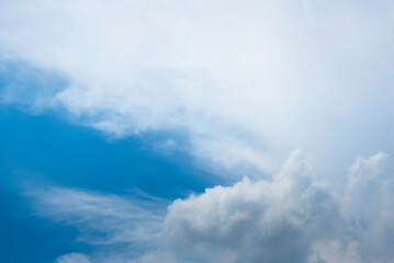 Obraz premium Tropical summer blue sky fluffy white cloud summertime on light sunny day cloudscape. Clear bright blue skyline spring sunlight climate background. Heaven blue environment ecology high scenic nature.