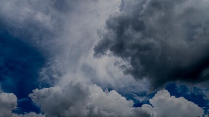 Obraz premium Dramatic dark storm thundercloud rain clouds on black sky background. Dark thunderstorm clouds rainny landscape. Meteorology danger windstorm disaster climate. Dark cloudscape storm disaster gray sky