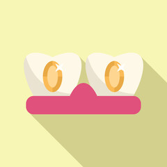 Two teeth with gold dental fillings, showing the concept of dental care