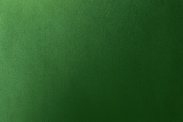 Emerald dark green tone color paint on environmental eco friendly blank cardboard box paper texture background with space minimal style