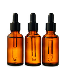 Amber Glass Dropper Bottles With Liquid Against a White Background