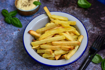  Home made   Fresh fried French fries  in a bowl on wooden rustic  background