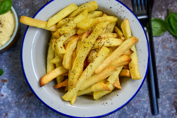  Home made   Fresh fried French fries  in a bowl on wooden rustic  background