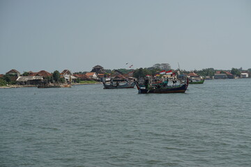 View of a group of fishing boats docked on the edge of the Jepara sea. Jepara, Indonesia