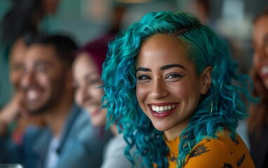 Fototapeta premium A happy woman with teal hair laughs with her coworkers in an office setting