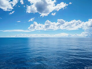 Obraz premium Serene Ocean Scene with Clear Blue Waters and Bright Sunlight Reflecting on the Water, No Land Visible on the Horizon, Scattered Clouds in the Sky