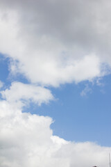 Blue sky and white puffy clouds.