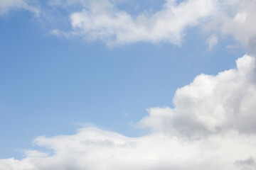 Blue sky and white puffy clouds.
