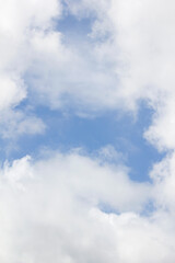 Blue sky and white puffy clouds.