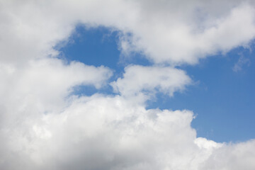 Blue sky and white puffy clouds.