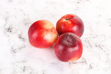 Ripe sweet juicy nectarines heap