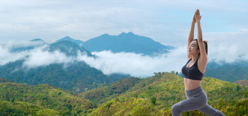 Young woman practicing yoga in the nature