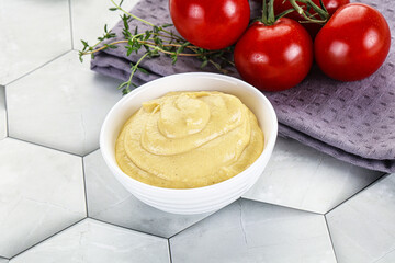 Dijon mustard sauce in the bowl