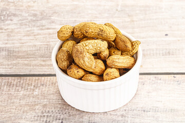 Raw ripe unpeeled peanut heap