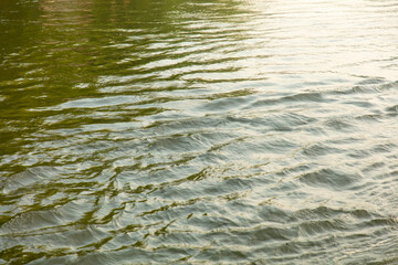 The surface of the water in the river as an abstract background. Texture