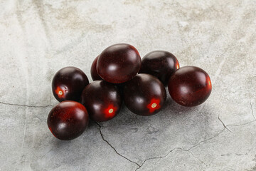 Raw ripe black kumato tomato